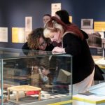 Two people exploring museum exhibit